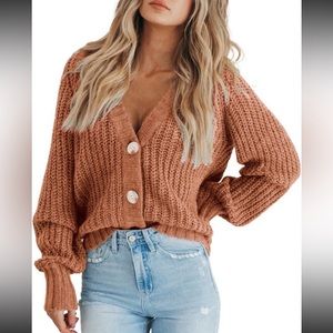 Woman’s small orange cardigan